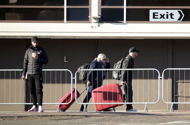Guests leave the Radisson Blu Hotel at Heathrow Airport after finishing quarantine. Reuters