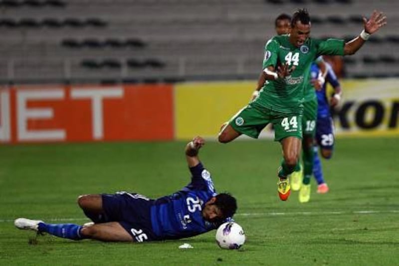 Al Shabab’s Ciel, centre, is challeneged by Al Hilal’s Majed Marshadi during the Asian Champions League Group D match.