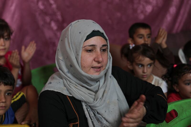 Najlaa Mimar, a history graduate, has set up the makeshift school. 