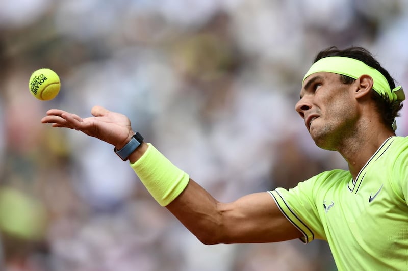 Nadal serves the ball to Thiem. AFP