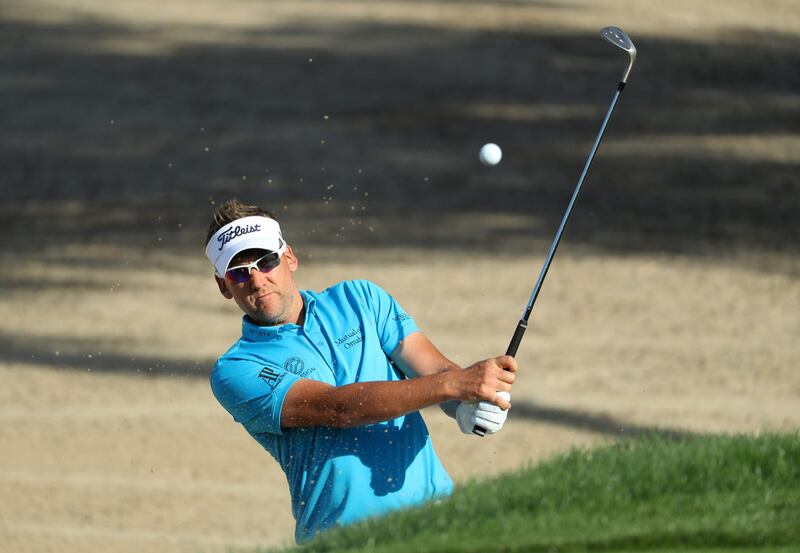 Ian Poulter hits from a bunker on the 15th hole during the final round of the Omega Dubai Desert Classic. Warren Little / Getty Images
