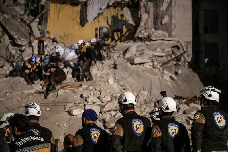 epa06903803 (FILE) - Volunteers of White Helmets search for survivors after an explosion in the city of Idlib, Syria, 09 April 2018, (reissued 22 July 2018). Media reports on 22 July 2018 state that around 800 White Helmets personnel and their families have been evacuated to Jordan via Israel, The Israel Defense Forces said. The White Helmets are a Syrian Civil Defence volunteer organisation.  EPA/MOHAMMED BADRA *** Local Caption *** 54254231