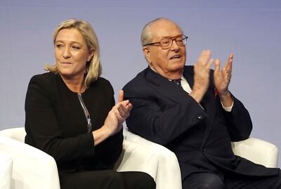 French far-right leader Marine Le Pen and her father Jean-Marie Le Pen pictured in Lyon, 2014. Ms Le Pen's presence at Sunday's march in Paris against anti-Semitism underlines a remarkable evolution for a movement founded by her father, who was repeatedly punished in the courts for anti-Semitic and racist statements. AP 
