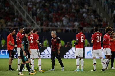 Manchester United's coach Jose Mourinho speaks with his players on a cooling break during the Super Cup final soccer match between Real Madrid and Manchester United at Philip II Arena in Skopje, Tuesday, Aug. 8, 2017. (AP Photo/Thanassis Stavrakis)