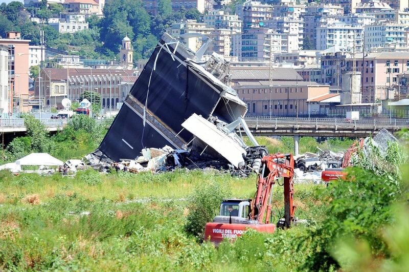 epa06951266 Rescue teams at work in the area of the collapsed Morandi bridge in Genoa, Italy, 15 August 2018.    The death toll for Tuesday's highway-bridge-collapse disaster in Genoa has risen to 39, according to reports on 15 August.  EPA/Alessandro Di Marco
