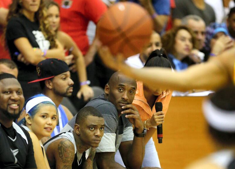 LA Lakers NBA player Kobe Bryant follows the game as he coaches a team made up of United Arab Emirates celebrities at the  American University of Dubai September, 27, 2013.  Bryant arrived for a Health and Fitness Weekend, to promote awareness of diabetes in the United Arab Emirates in his first trip to a Middle East country. AFP PHOTO/MARWAN NAAMANI (Photo by MARWAN NAAMANI / AFP)