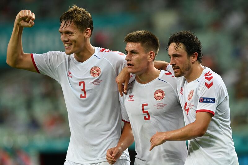 Denmark's Jannik Vestergaard, Joakim Maehle and Thomas Delaney celebrate their team's third goal during the EURO 2020 quarter-final against the Czech Republic at the Olympic Stadium in Baku on Saturday, July 3, 2021.