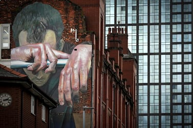 A mural on a wall in Manchester by German artist Case depicts the mental health issues which Covid restrictions have spawned. Getty