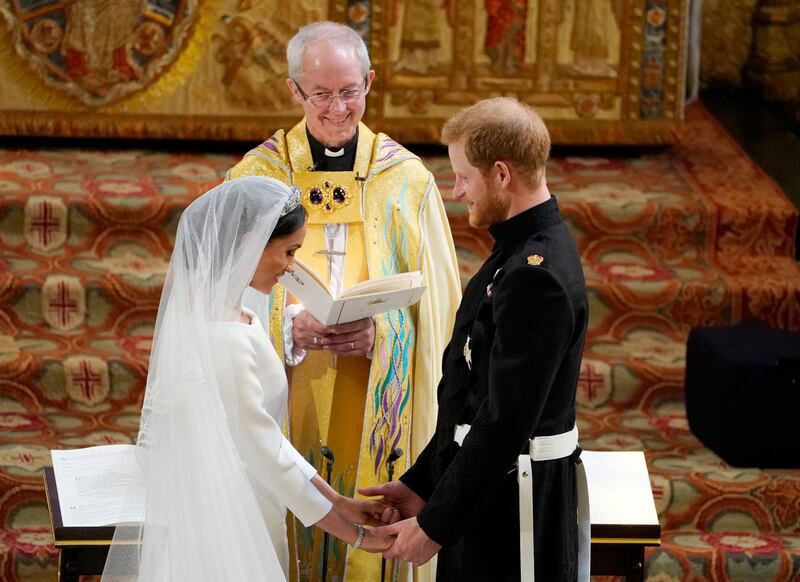 WINDSOR, ENGLAND - MAY 19: Prince Harry and Meghan Markle stand at the altar at St George's Chapel on May 19, 2018 in Windsor, England. (Photo by Owen Humphreys - WPA Pool/Getty Images)