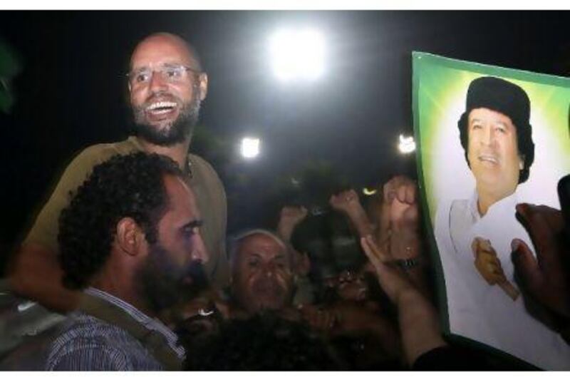 Pictures of Saif Al Islam Qaddafi, celebrating in Tripoli yesterday have hurt the rebels' credibility. AP Photo