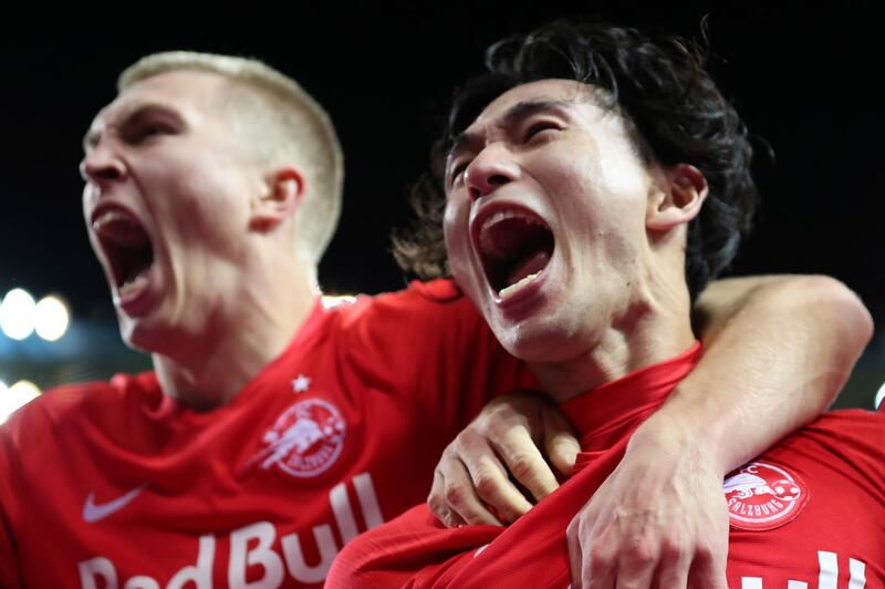 Takumi Minamino, right, will officially join Liverpool on January 1. AP