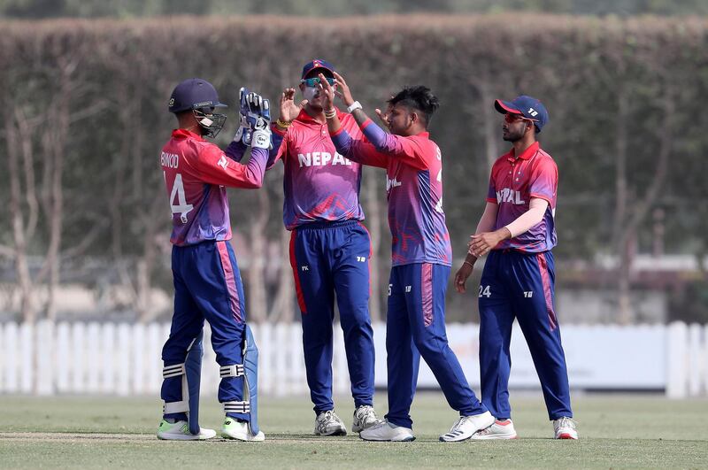 DUBAI , UNITED ARAB EMIRATES , January 28 – 2019 :- Sandeep Lamichhane ( 2nd from right ) of Nepal celebrating after taking the wicket of Ghulam Shabber during the one day international cricket match between UAE vs Nepal held at ICC cricket academy in Dubai. ( Pawan Singh / The National ) For Sports. Story by Paul