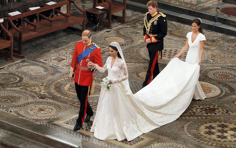 LONDON, ENGLAND - APRIL 29: Prince William takes the hand of his bride Catherine Middleton, now to be known as Catherine, Duchess of Cambridge, followed by Prince Harry and Pippa Middleton as they walk down the aisle inside Westminster Abbey on April 29, 2011 in London, England.  The marriage of Prince William, the second in line to the British throne, to Catherine Middleton is being held in London today. The marriage of the second in line to the British throne is to be led by the Archbishop of Canterbury and will be attended by 1900 guests, including foreign Royal family members and heads of state. Thousands of well-wishers from around the world have also flocked to London to witness the spectacle and pageantry of the Royal Wedding.  (Photo by  Kirsty Wigglesworth - WPA Pool/Getty Images)