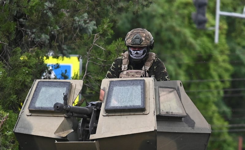 A Wagner fighter on top of an armoured vehicle in Rostov-on-Don. Reuters