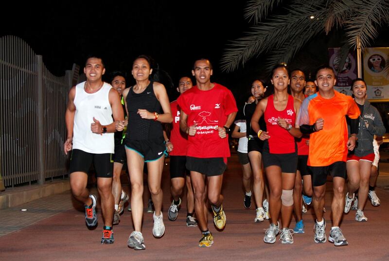 Dubai, 28th December 2010.  (3rd from left) Euca Bolingot (28 years old) and Amor Bautista (29 years old) leads the members of Filipino Runners UAE, during their jogging regimen around Zabeel Park.  (Jeffrey E Biteng / The National)  Editor's Note; Ramona R reports.