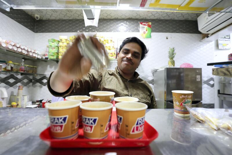 Ras Al Khaimah, United Arab Emirates - November 27th, 2019: Mohammed Ali prepares karak tea. National Day feature on Rounding where people drink tea in their cars. Wednesday, November 27th, 2019, Ras Al Khaimah. Chris Whiteoak / The National