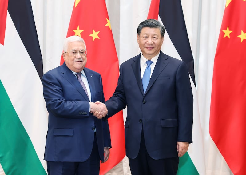 Mr Xi and Palestinian President Mahmoud Abbas. AP