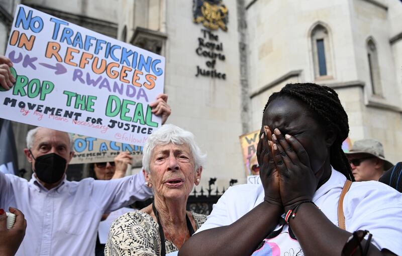 Human rights campaigners outside the High Court in London, after an Appeal Court judge ruled against stopping the UK flying asylum seekers to Rwanda. It subsequently went to judicial review. EPA