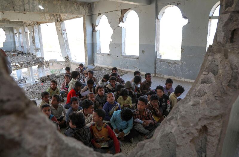 Yemeni children attend class on the first day of the new academic year in the country's third-city of Taez.  AFP