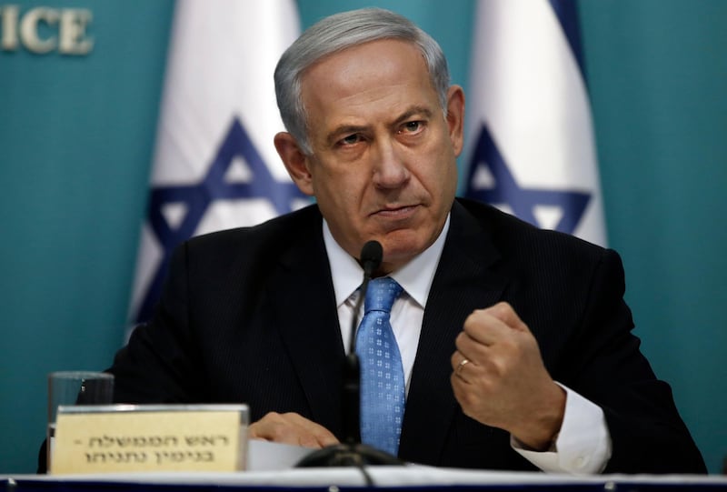 (FILES) In this file photo taken on August 27, 2014 Israeli Prime Minister Benjamin Netanyahu gestures as he delivers a speech during a press conference at the prime minister office in Jerusalem. The International Criminal Court's ruling that it has jurisdiction over events in the Palestinian territories opens the way to an investigation of alleged war crimes committed in the 2014 Israeli-Palestinian conflict in Gaza. The 50-day war, which devastated the coastal enclave and left 2,251 dead on the Palestinian side, mostly civilians, and 74 on the Israeli side, mostly soldiers, has already been the subject of a five-year preliminary ICC probe and a string of critical reports. / AFP / THOMAS COEX
