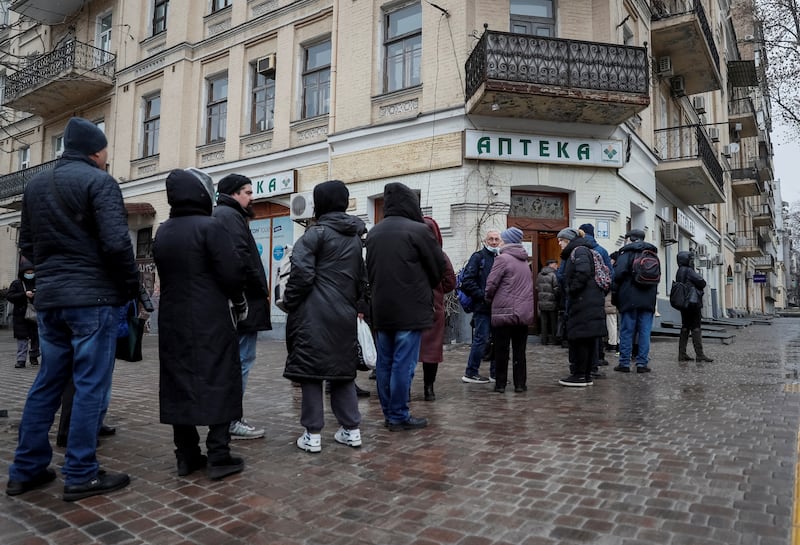 People queue at a pharmacy in central Kyiv. Reuters