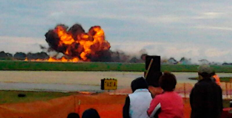 A vintage military T-28 aircraft crashes at an air show in Martinsburg, West Virginia, September 17, 2011 as shown in this eye-witness photograph by Morgan McEachern. According to Federal Aviation Administration spokesperson Jim Peters, the T-28 was part of a formation of six T-28s. The plan crashed onto runway 26 during maneuvers.   REUTERS/Morgan McEachern/Handout   (UNITED STATES - Tags: TRANSPORT DISASTER) THIS IMAGE HAS BEEN SUPPLIED BY A THIRD PARTY. IT IS DISTRIBUTED, EXACTLY AS RECEIVED BY REUTERS, AS A SERVICE TO CLIENTS FOR EDITORIAL USE ONLY. NOT FOR SALE FOR MARKETING OR ADVERTISING CAMPAIGNS *** Local Caption ***  WAS07RR_CRASH-AIRRA_0918_11.JPG