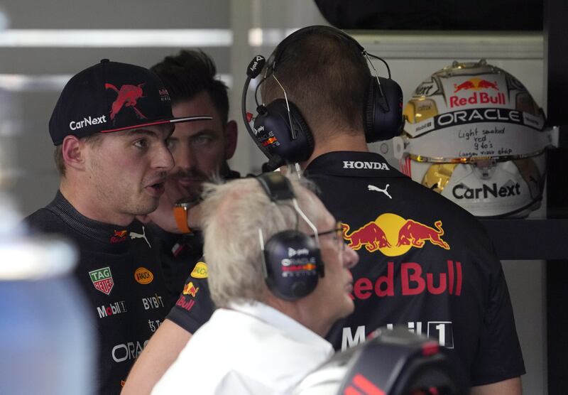 Max Verstappen speaks with a Red Bull crew member after he retired during the Formula One Australian Grand Prix. EPA