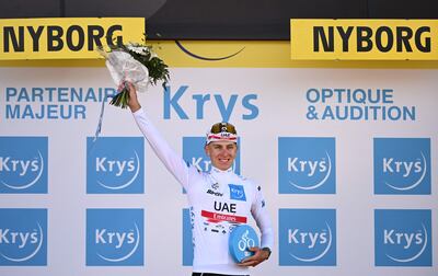 UAE Team Emirates' Slovenian rider Tadej Pogacar celebrates on the podium with the best young rider jersey after the second stage of the Tour de France on July 2, 2022. AFP