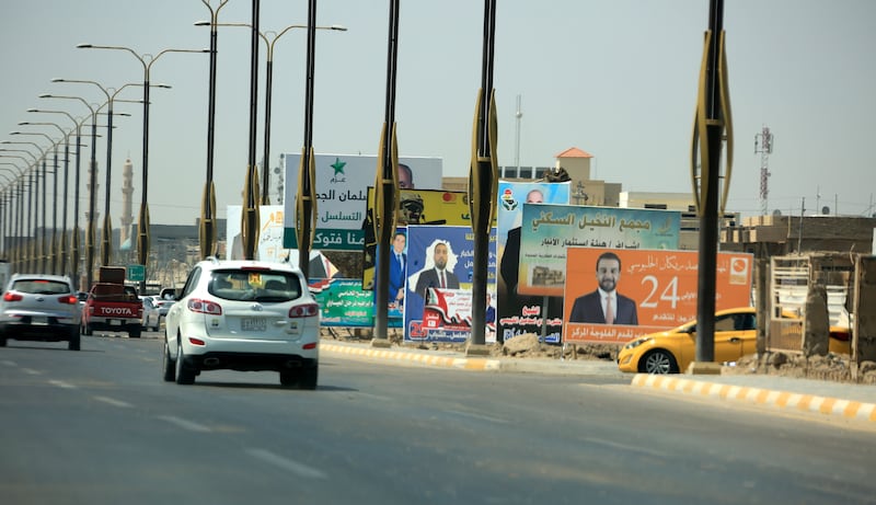 Iraqis pass by-election campaign posters for Iraqi candidates at a street in Fallujah city, 60 kilometres west of Baghdad, Iraq.  The Special Representative for the United Nations Assistance Mission for Iraq, Jeanine Antoinette Hennis-Plasschaert, announced on 07 September 2021, that a group of 130 international experts and around 600 supporting staff will be monitoring Iraqâ€™s upcoming elections. EPA