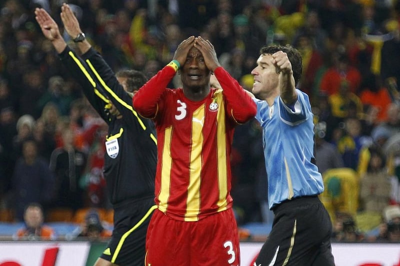 Asamoah Gyan reacts after missing a penalty against Uruguay in the 2010 World Cup quarter-finals. Kai Pfaffenbach / Reuters / July 2, 2010