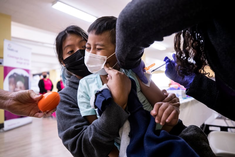 A 6-year-old receives a dose of the Pfizer Covid-19 vaccine at a vaccination clinic in Los Angeles. EPA