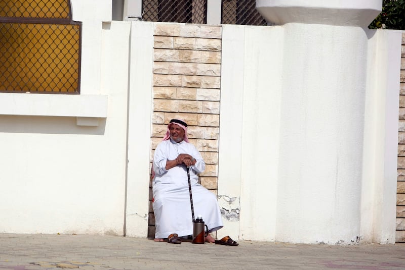 An man relaxes outside his home in the Al Zaab neighborhood  of Abu Dhabi on January 2, 2010. Sammy Dallal / The National