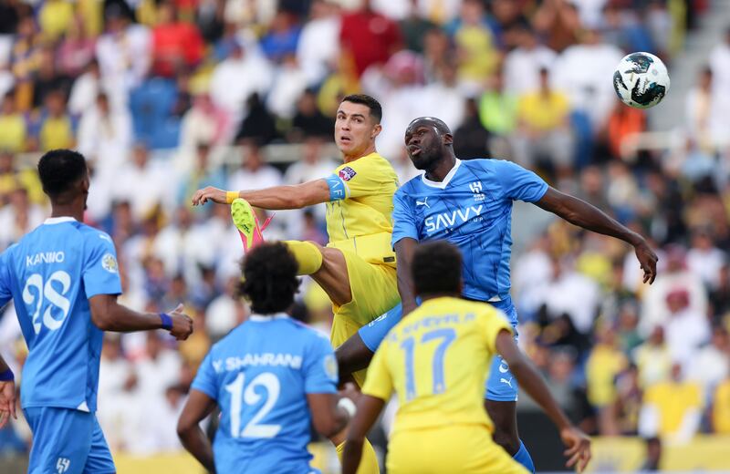 Nassr's Cristiano Ronaldo and Kalidou Koulibaly of Al Hilal battle for a header. Getty