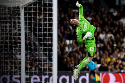 Real Madrid's Ukrainian goalkeeper Andriy Lunin dives to save the ball during the UEFA Champions League first round group C football match between Real and Napoli. AFP