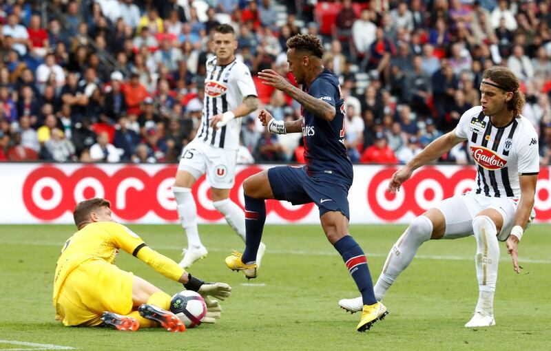 Neymar in action with Angers' Ludovic Butelle. Reuters