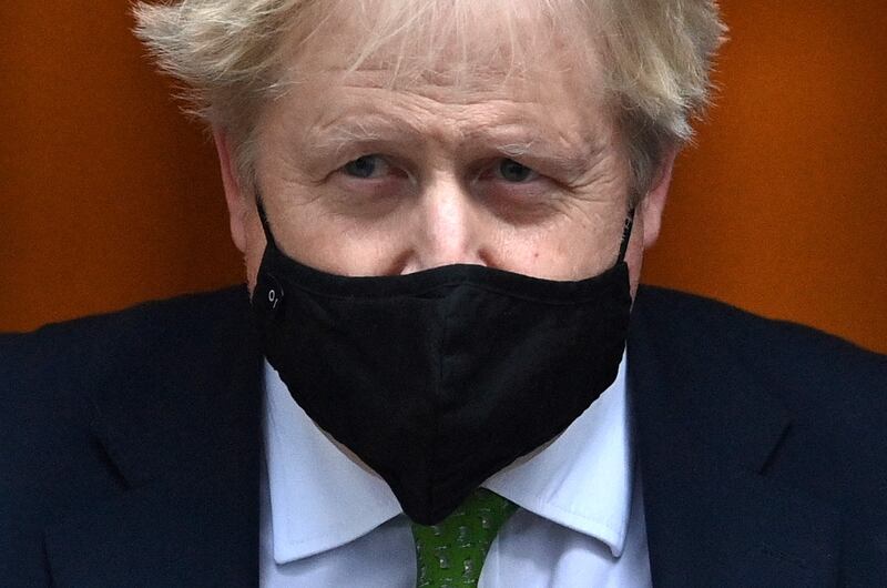 Britain's Prime Minister Boris Johnson leaves 10 Downing Street in central London. Mr Jonson said Covid Plan B restrictions in England will be lifted from January 27. AFP