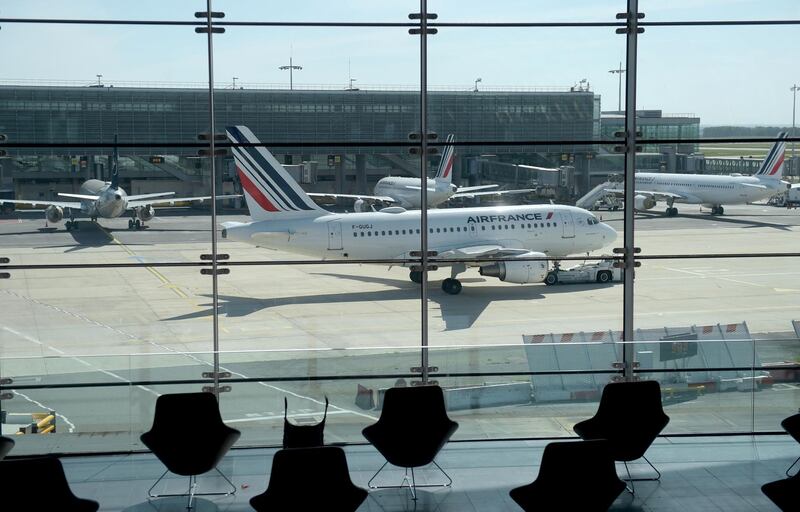 (FILES) This file photo taken on May 12, 2020 shows an Air France Airbus A318 moving on the tarmac at the Paris-Charles de Gaulle airport in Roissy-en-France, as empty seats are seen in the foreground. Air traffic volume to and from Paris could take up to seven years to recover from the coronavirus impact, the CEO of the French capital's airports said on July 27, 2020. / AFP / ERIC PIERMONT
