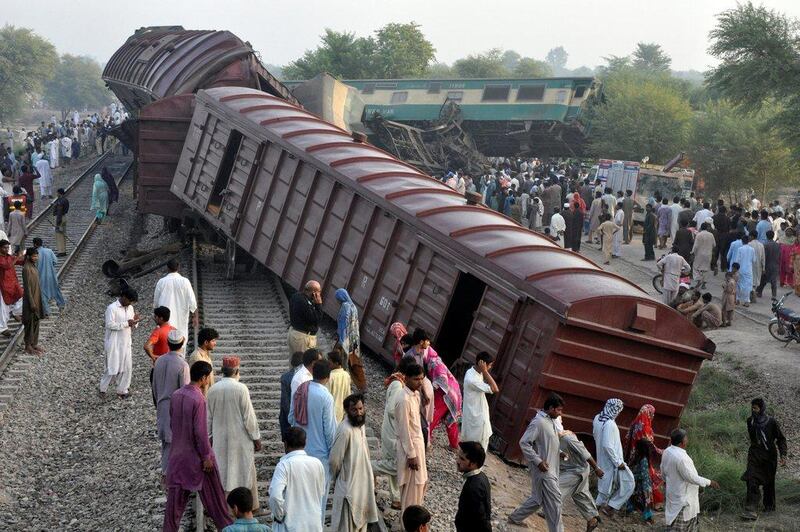 Locals gather at the scene where two trains collided near Multan, Pakistan on September 15, 2016. Khalid Chaudry / Reuters