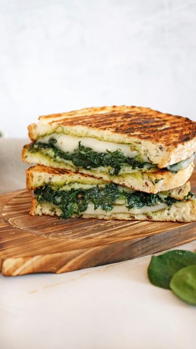 The grilled 'cheese' sandwich with fresh spinach, basil, pine nuts, walnuts, vegan 'cheese', lemon juice, extra virgin oil and country bread, served with crunchy fries. Photo: Bloom Vegan Kitchen