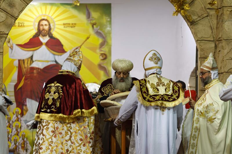 A priest leads the Christmas Mass.