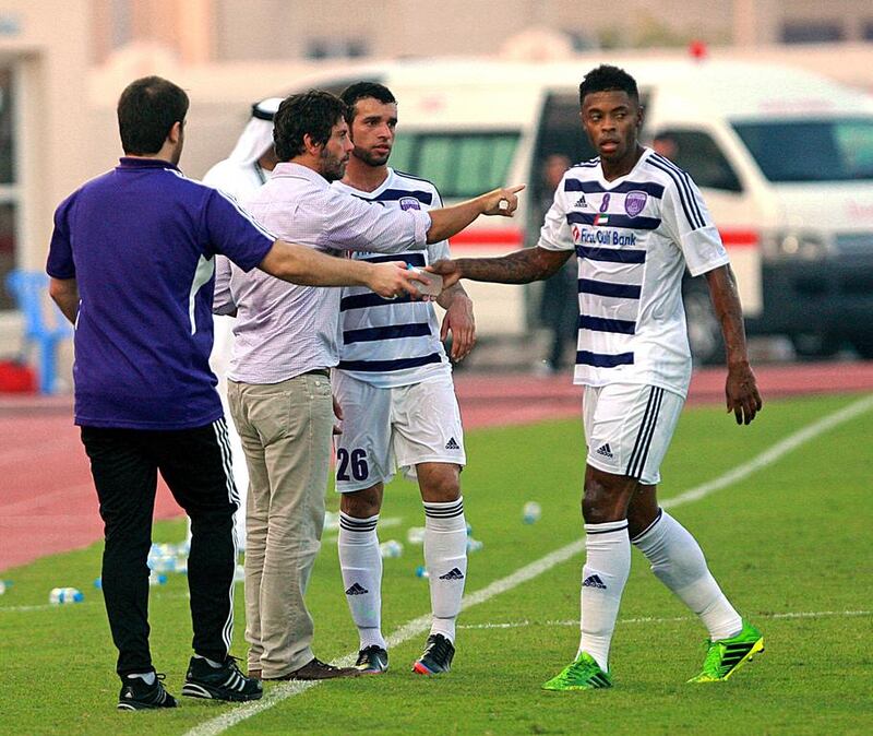 In his first appearance as Al Ain manager, Quique Sanchez Flores, second from the left, was cool and collected as his new Garden City squad responded with a comfortable victory at Al Shaab on Friday night. Satish Kumar / The National



