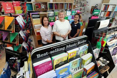 Dubai, United Arab Emirates - Reporter: Patrick Ryan: Carolyn Belsey Morton runs a music shop called 'The Music Room' in Dubai. Pictured with her two employees Michelle Gaan (L) and Jane Quilaquiga (R). Tuesday, January 21st, 2020. The Beach Centre, Dubai. Chris Whiteoak / The National