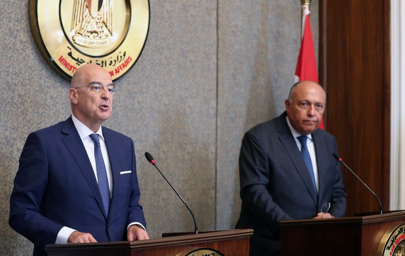 Greek Foreign Minister Nikos Dendias, left, and Egyptian Foreign Minister Sameh Shoukry at a press conference in Cairo on October 9. EPA