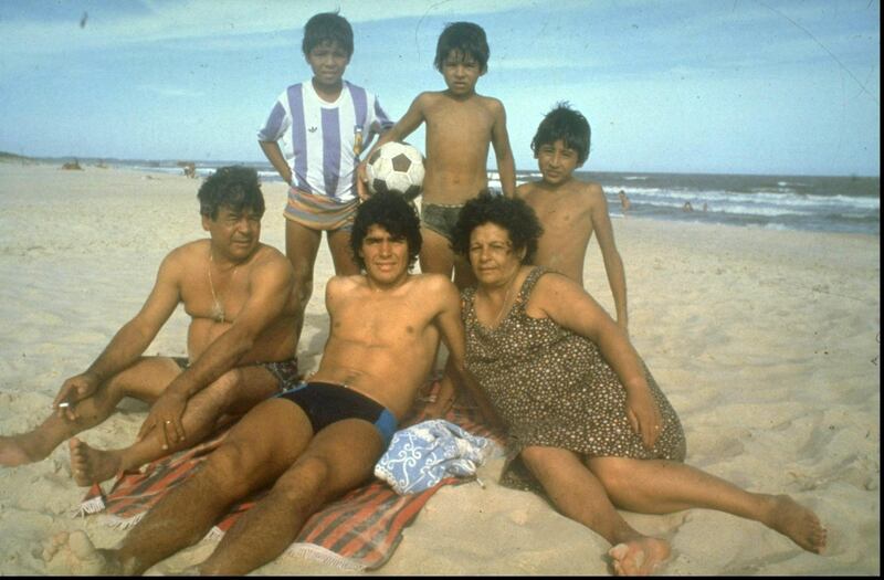 1970:  A young Diego Maradona (centre) of Argentina relaxing with his family on a beach. \ Mandatory Credit: Allsport UK /Allsport