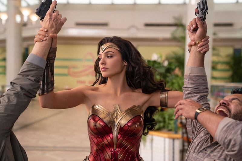 This image released by Warner Bros. Pictures shows Gal Gadot as Wonder Woman in a scene from "Wonder Woman 1984." Following the less-than-stellar theatrical debut of Christopher Nolanâ€™s â€œTenet,â€ Warner Bros. is delaying its next big release, â€œWonder Woman 1984,â€ to Christmas. (Clay Enos/Warner Bros Pictures via AP)