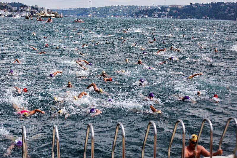 Competitors in the Bosphorus Cross-Continental Swim race between Istanbul's Asian and European sides on Sunday, August 22. Reuters