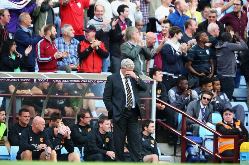 Steve Bruce, manager of Hull City, reacts after the second Aston Villa goal scored by Andreas Weimann during Villa's 2-1 win in the Premier League on Sunday. Clive Mason / Getty Images