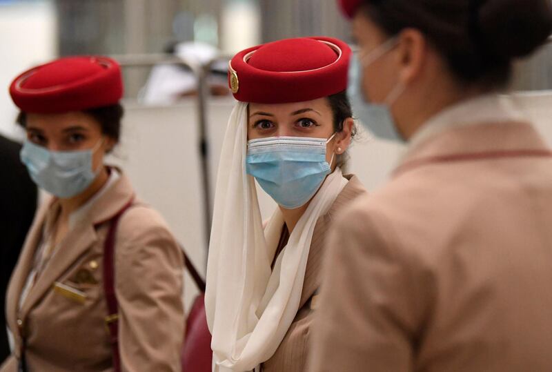 Crew members of an Emirates flight from London arrive at Dubai International Airport. AFP