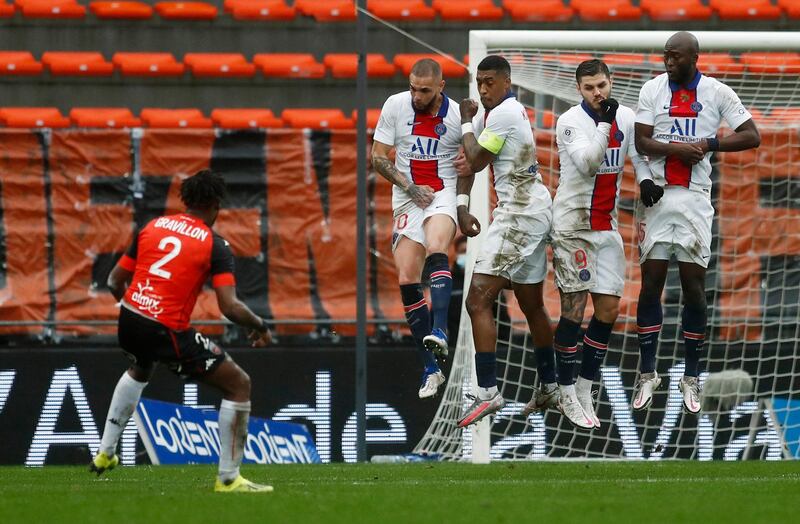 Lorient's Andrew Gravillon shoots at goal from a free kick. Reuters