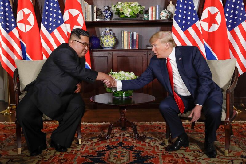 North Korea leader Kim Jong Un and US President Donald Trump during their first meeting. Evan Vucci / AP Photo